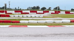 Racing on the karting race track ; Race with the Go Karts vehicles on the race track,video clip