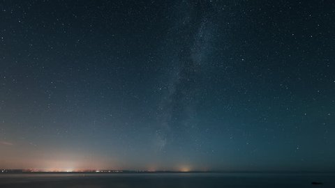 4K time lapse sequence of a starry night with the Milky Way with Perseid meteor shower transitioning into dawn over Georgian Bay, Ontario, Canada.