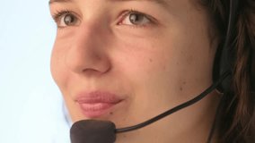 Extreme close up of young woman face with microphone and headset