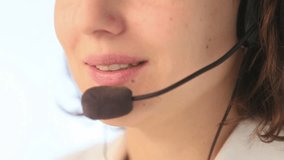 Extreme close up of mouth of young woman with microphone and headset