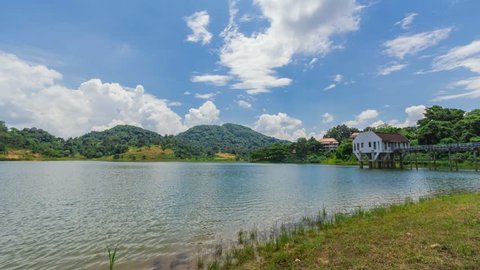 Timelapse clouds and blue sky with Mountain and Lake dam inThailand