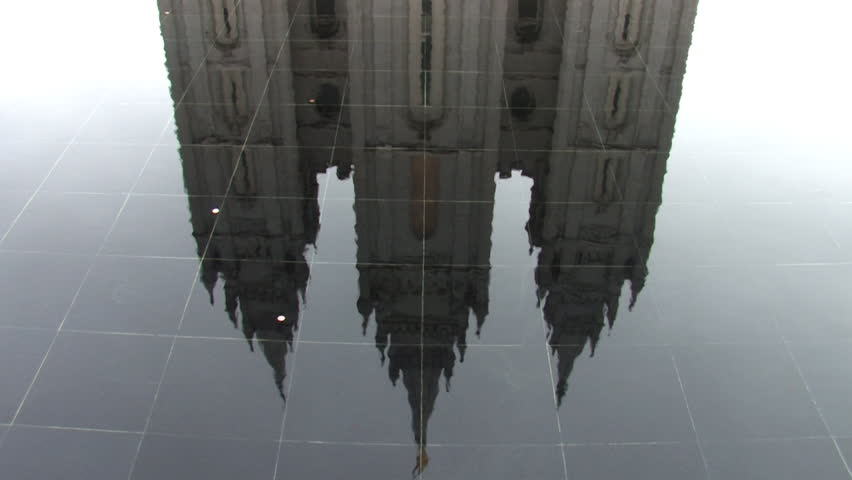 Video of the Mormon Temple in Salt Lake City Utah. Granite edifice reflecting in fountain. Church of Jesus Christ of Latter-Day Saints, Mormon. Religious belief of LDS Church. Pan up