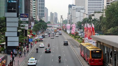Jakarta, Indonesia - August 21 2015: Traffic around the Plaza Indonesia roundabout along Sudirman, a major avenue in Jakarta business district in Indonesia capital city.