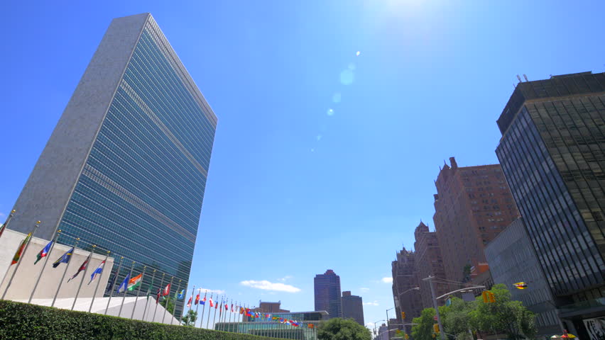 Panning view over NYC skyscrapers ending on the United Nations building headquarters, New York City, sunny summer day
