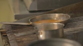 Steaming pot of food in a professional kitchen - Powered by Shutterstock - Get 15% off with code: PIKWIZARD15