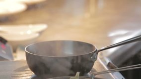 Steaming pot of food in a professional kitchen - Powered by Shutterstock - Get 15% off with code: PIKWIZARD15