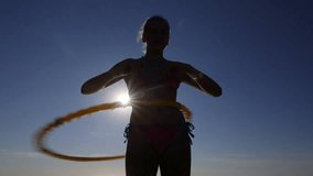  Young girl with massage hula hoop during fitness exercise abdominal workout - Powered by Shutterstock - Get 15% off with code: PIKWIZARD15