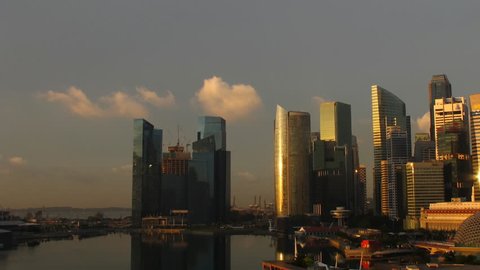 Time lapse Singapore skyline at night. Pan movement.