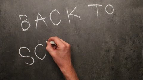 Back to school written by hand on chalkboard - stop motion animation