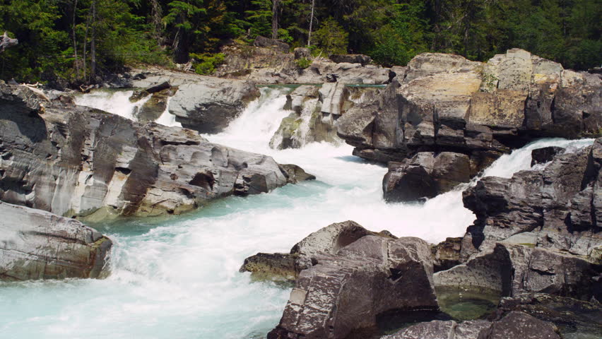 Slow motion rapids of glacier runoff  and rocky river in Glacier national park in Montana.