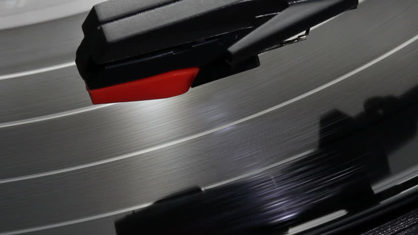 A spinning vinyl phonograph record close up