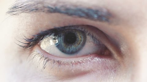 young woman's eye: blue eye
