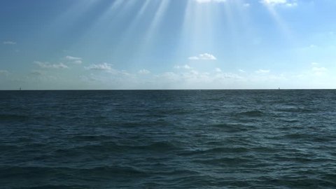 Sunshine over calm blue sea, 4K
