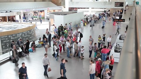 ST. PETERSBURG, RUSSIA - CIRCA JUL, 2015: Passengers wait at departure lounge for aircraft boarding. Interior of new terminal of Pulkovo International airport