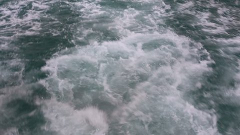 Water waves behind the boat