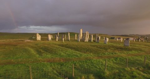 Cinematic aerial shot of Callanish standing stones on the Isle of Lewis, Outer Hebrides, Scotland