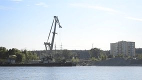Crane of barge moving on riverbank in Vyshgorod, Kiev oblast, Ukraine