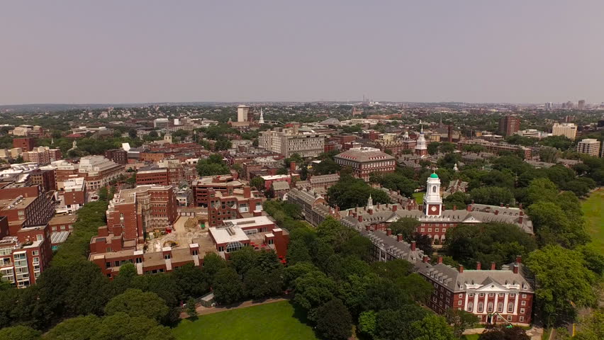 Boston Aerial v100 Flying low over Harvard campus panning right with cityscape views.