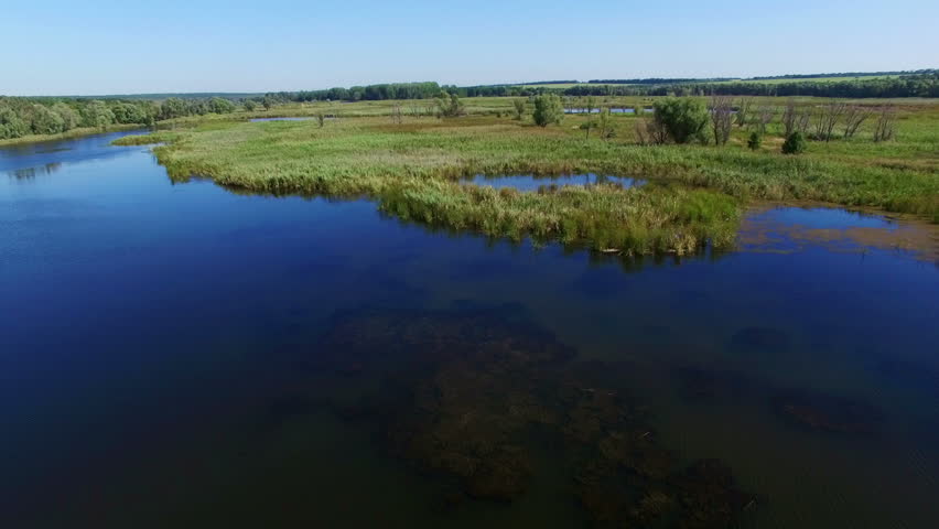 Aerial: flying over river
