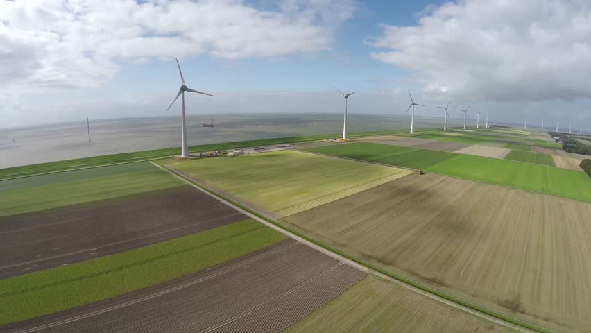 Aerial of wind turbine wind park view from above bird eye helicopter view green engineering near sea providing wind energy green energy renewable energy showing mast and blades aerofoil-powered 4k Royalty-Free Stock Footage #11565140