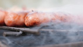 Smoke spreading over  sausages on the barbecue 4K 2160p 30fps UltraHD footage - Mouthwatering juicy sausages on bbq smoke grilling 4K 3840X2160 UHD video