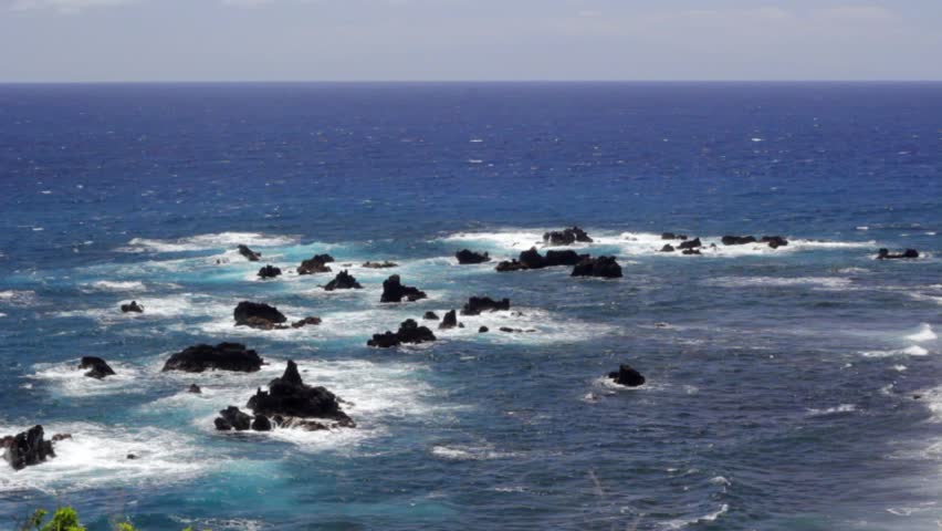 A rocky ocean shore on a tropical island