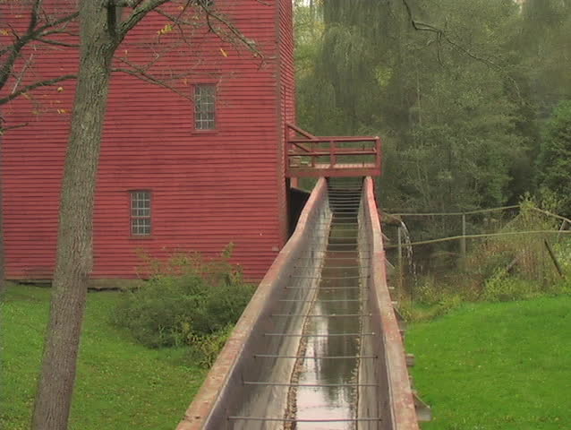 LONG SHOT OF AN EIGHTEENTH CENTURY MILL NEAR PORT ROWAN ONTARIO CANADA. STILL IN OPERATION TODAY.