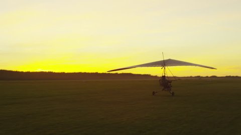 Moving Motorized Deltaplane at Sunset. Shot on RED Cinema Camera in 4K (UHD).