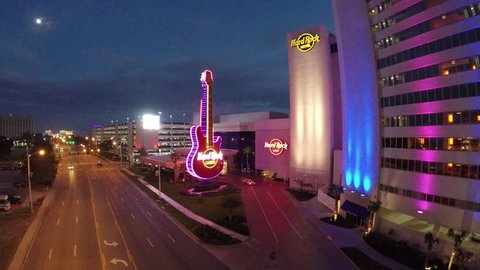 Biloxi, MS - February 2015: Night shot, flying straight toward and over the Biloxi Hard Rock Caf_ large neon guitar.