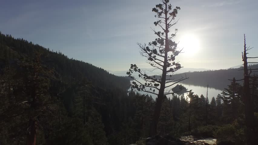Flying low through Redwood trees out to Emerald Bay at Lake Tahoe.