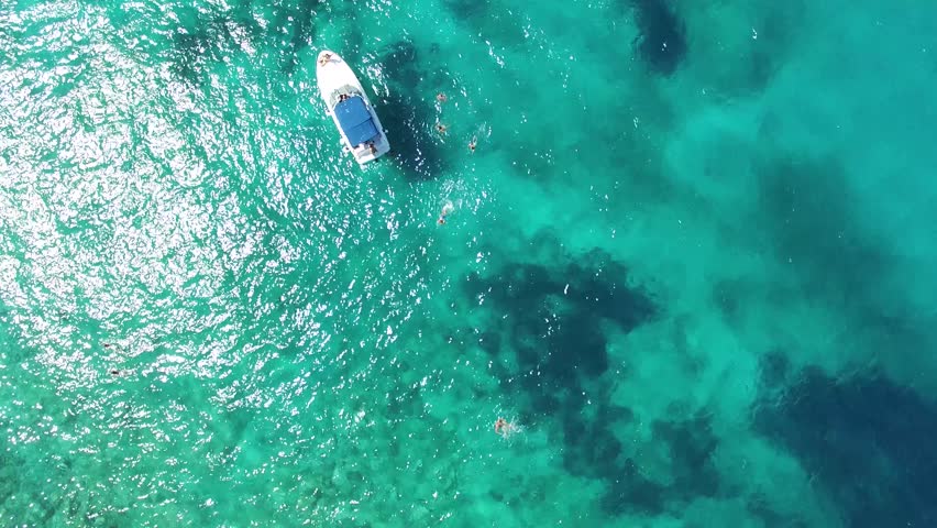 Aerial view of boat in the clear water near the beach Zanjica, Montenegro   | Shutterstock HD Video #11598725
