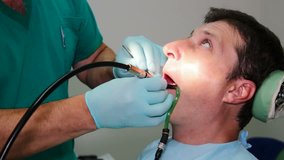 Dentist fixes the patient's teeth, Repairing Patient's Teeth, Video clip