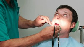 Dentist fixes the patient's teeth, Repairing Patient's Teeth, Video clip