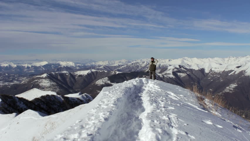 When you get to the top of a mountain, after a long and difficult trek, the boy greets the world with happiness.
 /  Boy on top of the mountain greets the world
