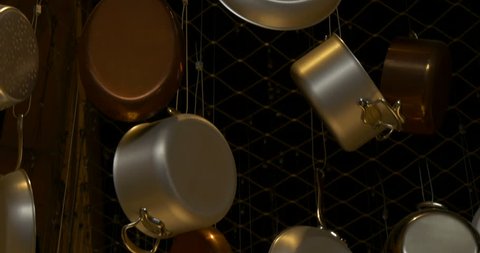 Stainless steel cookware hanging and dangling