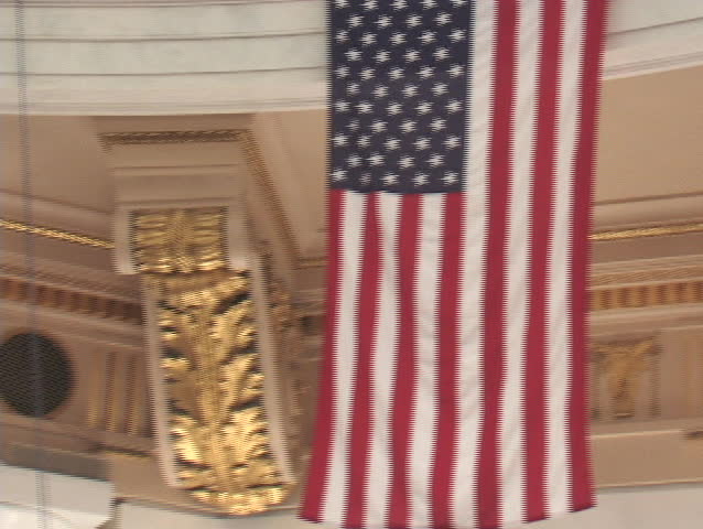 American flags hanging in the Pennsylvania State Capitol building.