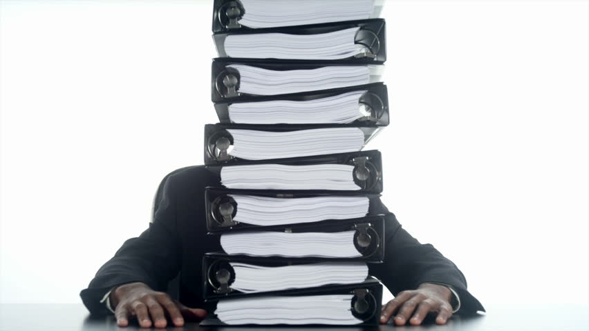 An African man with stack of binders