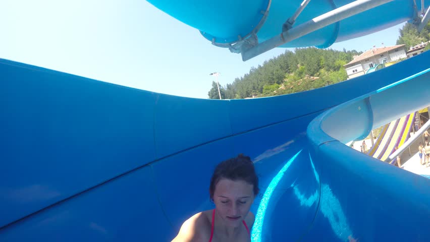 Girl ride on Water slide at Aqua Park