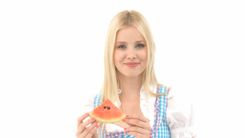 Woman in Dirndl eats Watermelon