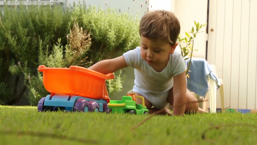 toddlers playing with trucks