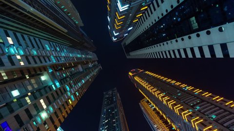 dubai city night illumination apartment buildings up view 4k time lapse uae