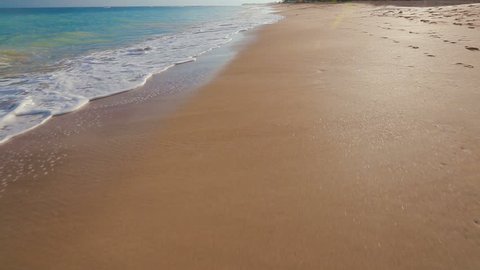 Ocean Scenic Landscape. Waves Rolling and Crashing on White Sandy Beach. Incoming Swell Gently Washes on Shoreline in Maui