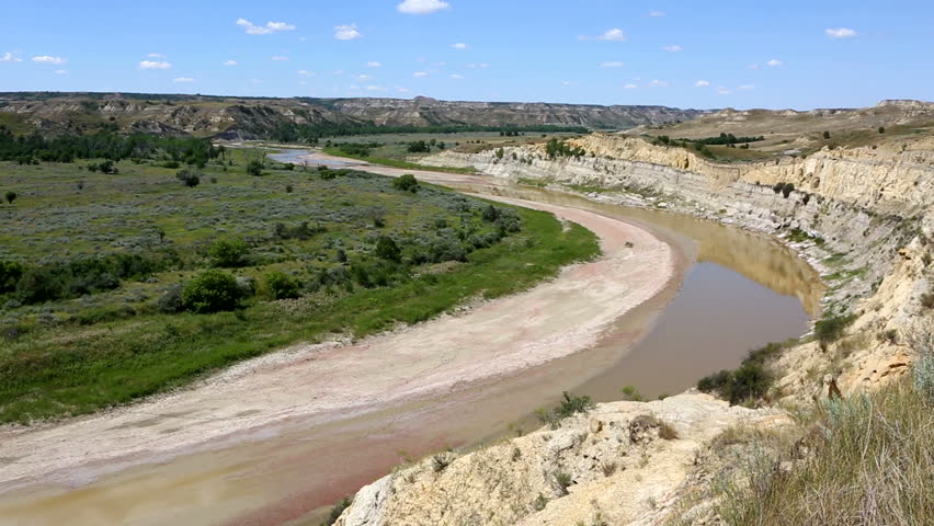 Camera pans across a view  overlooking the Littler Missouri River in Theodore Roosevelt National Park in North Dakota, USA.