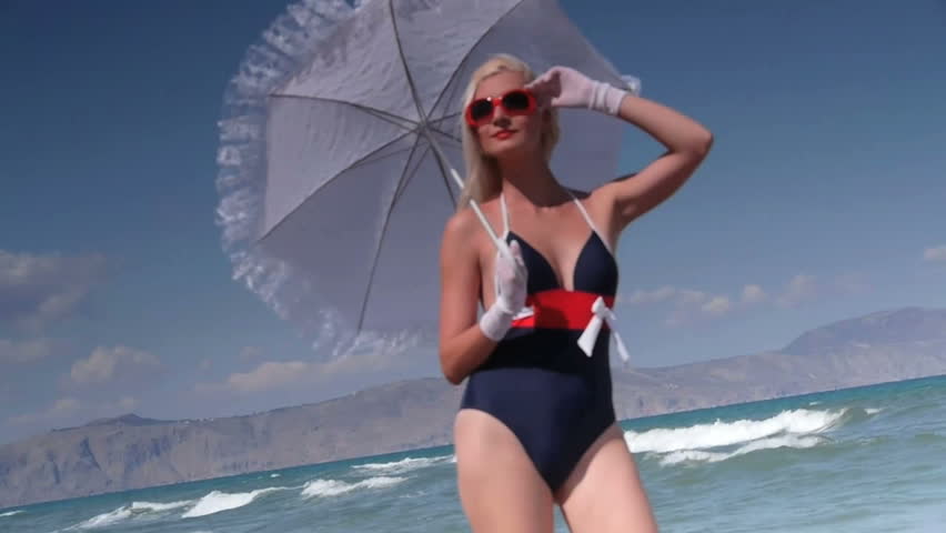 Beautiful blond woman having fun on beach