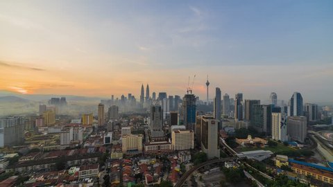 Sunrise view of misty Kuala Lumpur at rush hour, Time lapse
