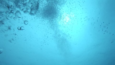 Bubbles rising to the surface from a scuba diver