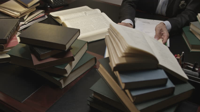 Businessman working and exploring books in the working room. Shot on RED EPIC Cinema Camera. Royalty-Free Stock Footage #11660813