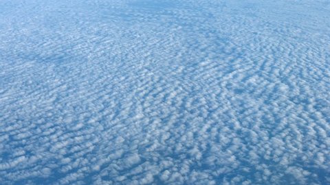 Video 4k - Airborne shot of Altocumulus Clouds over an Expanse of Open Ocean. from Above