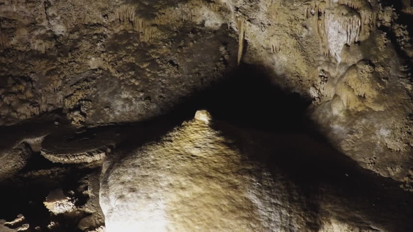 Shot of a huge mammary shaped stalagmite at Carlsbad Caverns National Park. Underground rock formation looks like a female breast and nipple. 