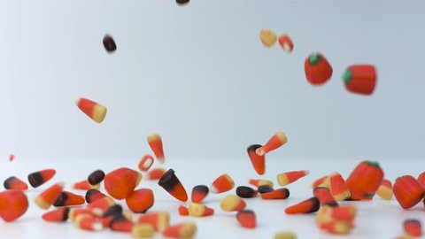 halloween candy falling in slow motion on white background